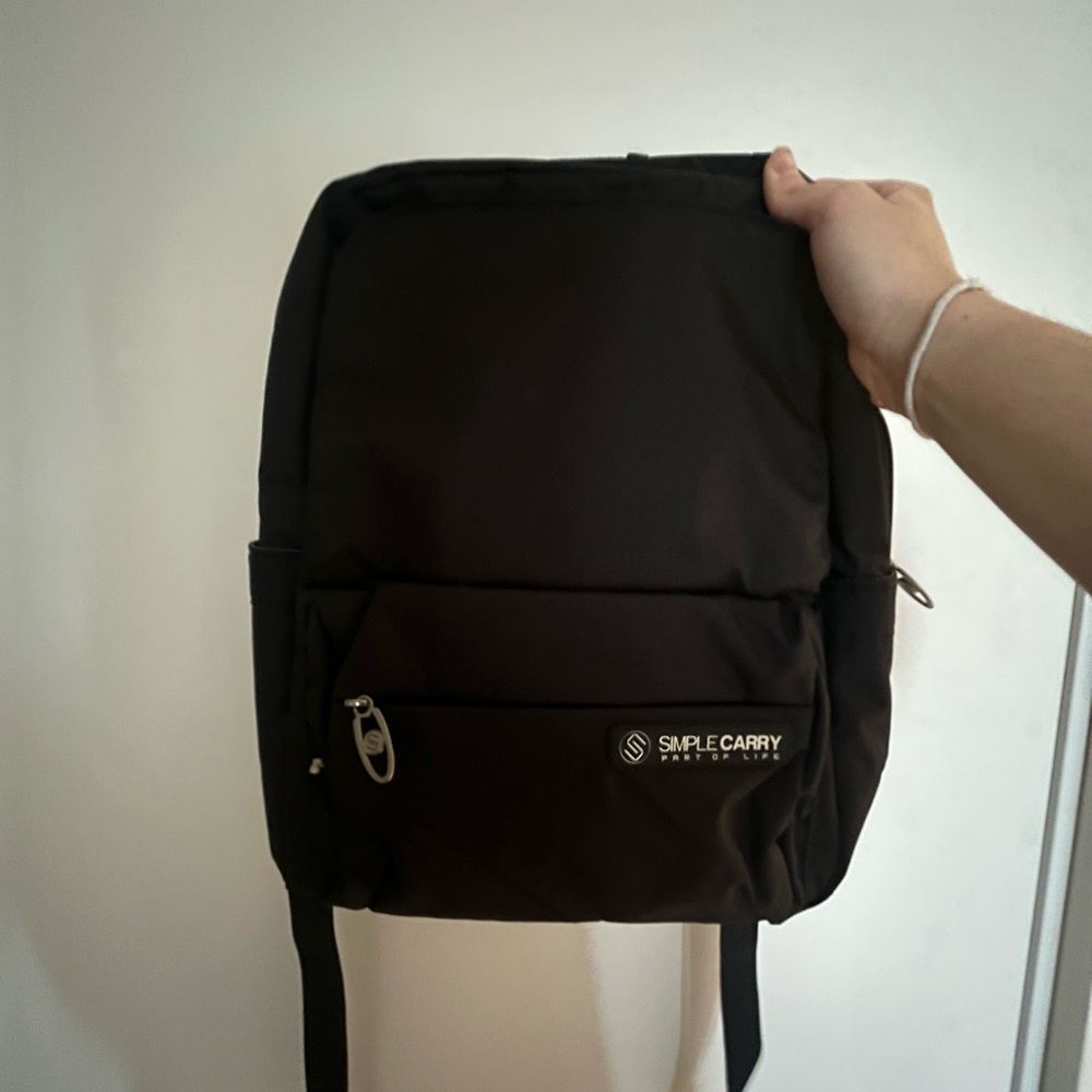 Black Backpack with Modern Design and Multiple Compartments